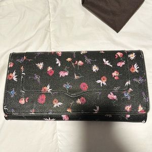 Rebecca Minkoff black flowered clutch.